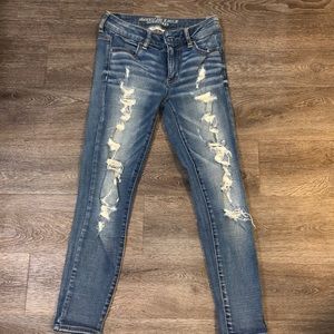 Skinny medium blue ripped American eagle jeans